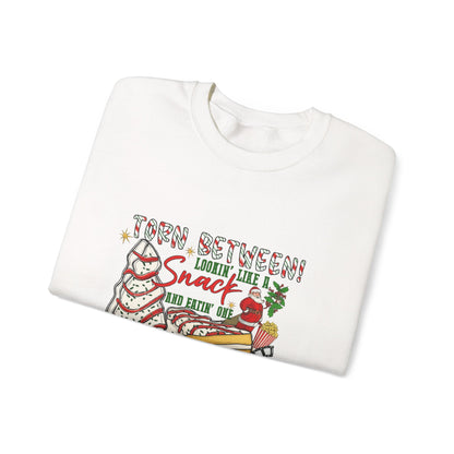 Unisex Heavy Blend™ mw2027 | Torn Between Looking Like a Snack Christmas Sweatshirt – Funny Holiday Crewneck | Cute Unisex Winter Gift